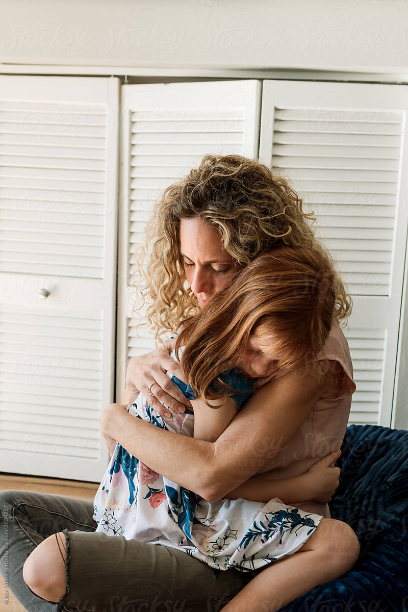 Mother Hugging Daughter