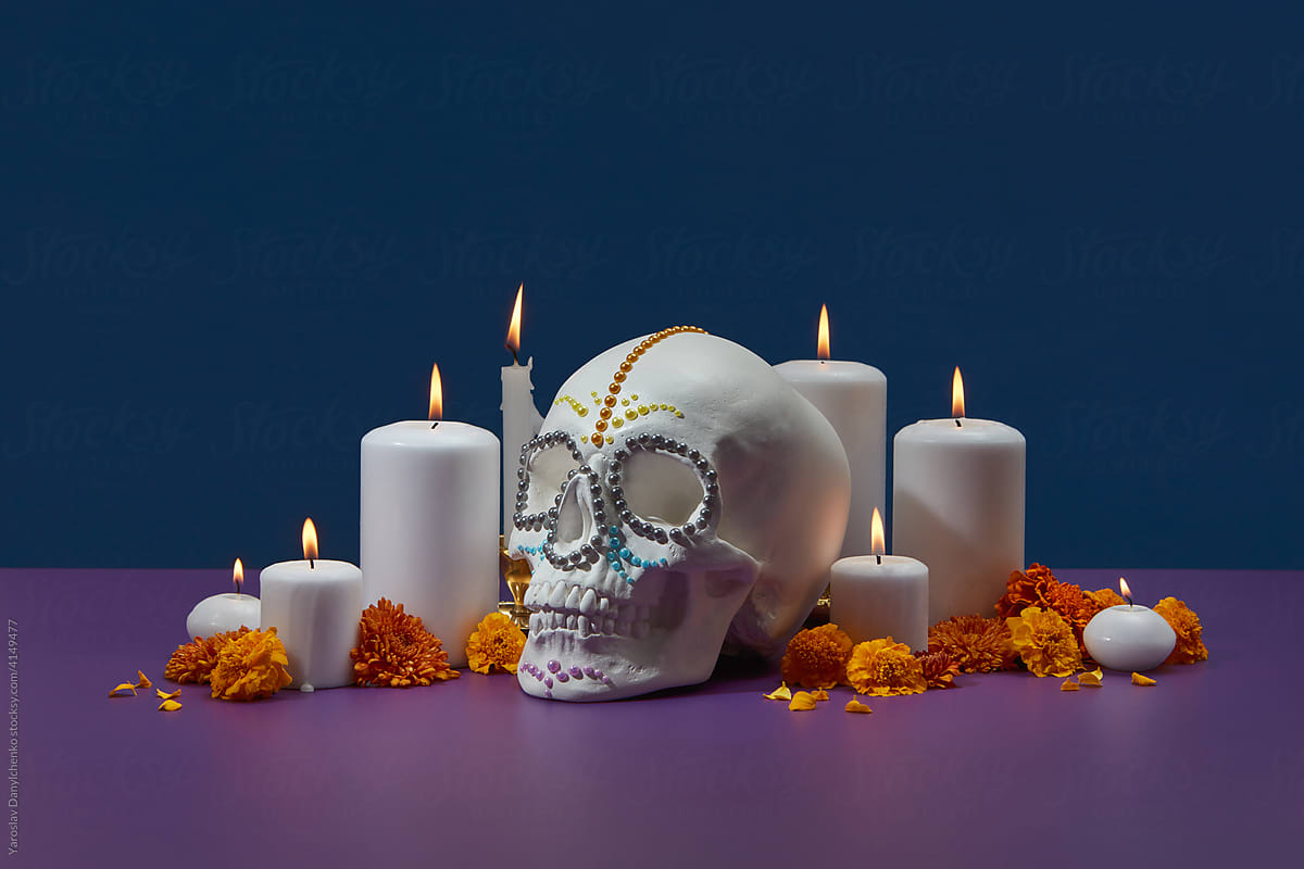 Decorative skull with candles and flowers