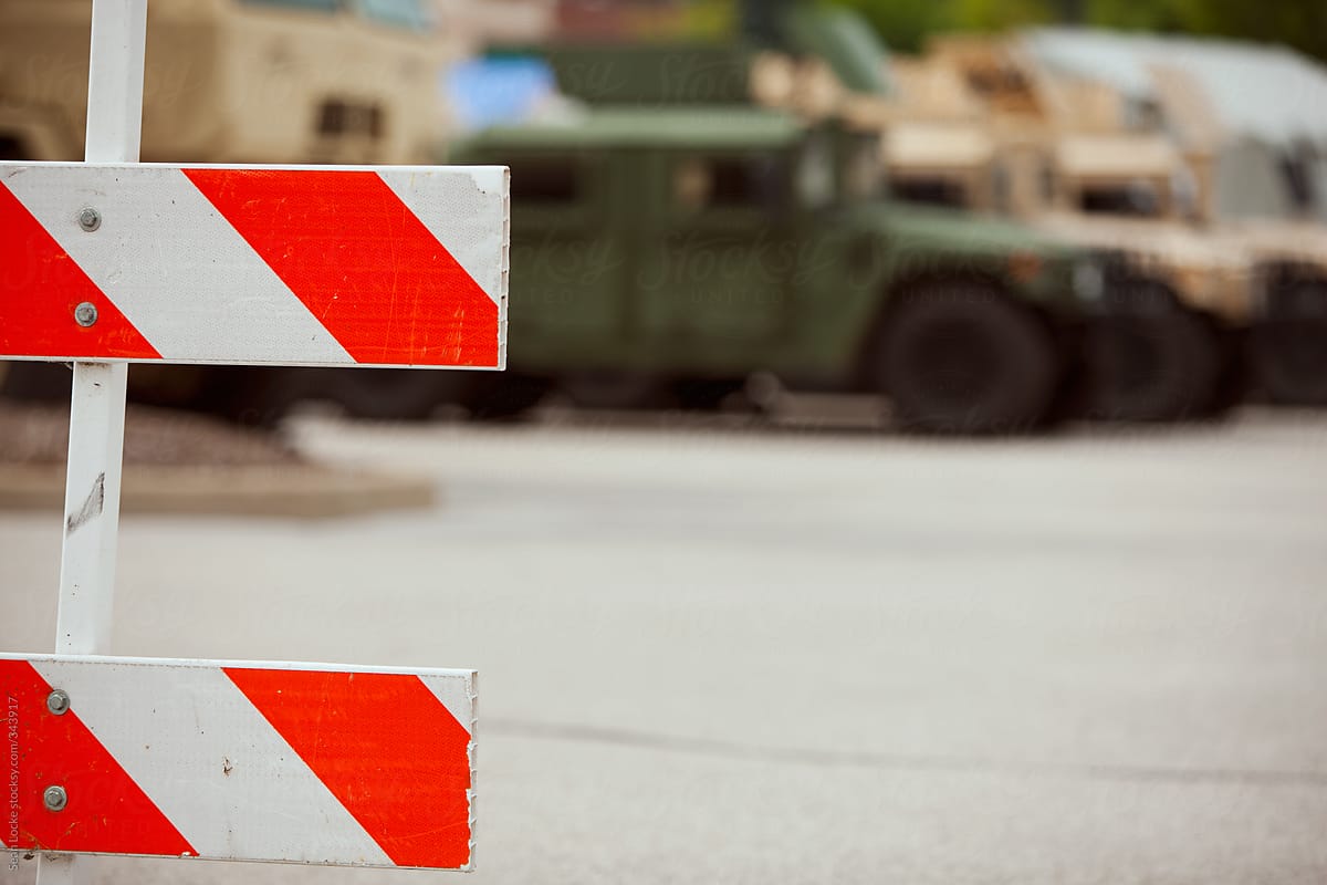 Ferguson: Row Of Military Vehicles Behind Barricade At Command Center