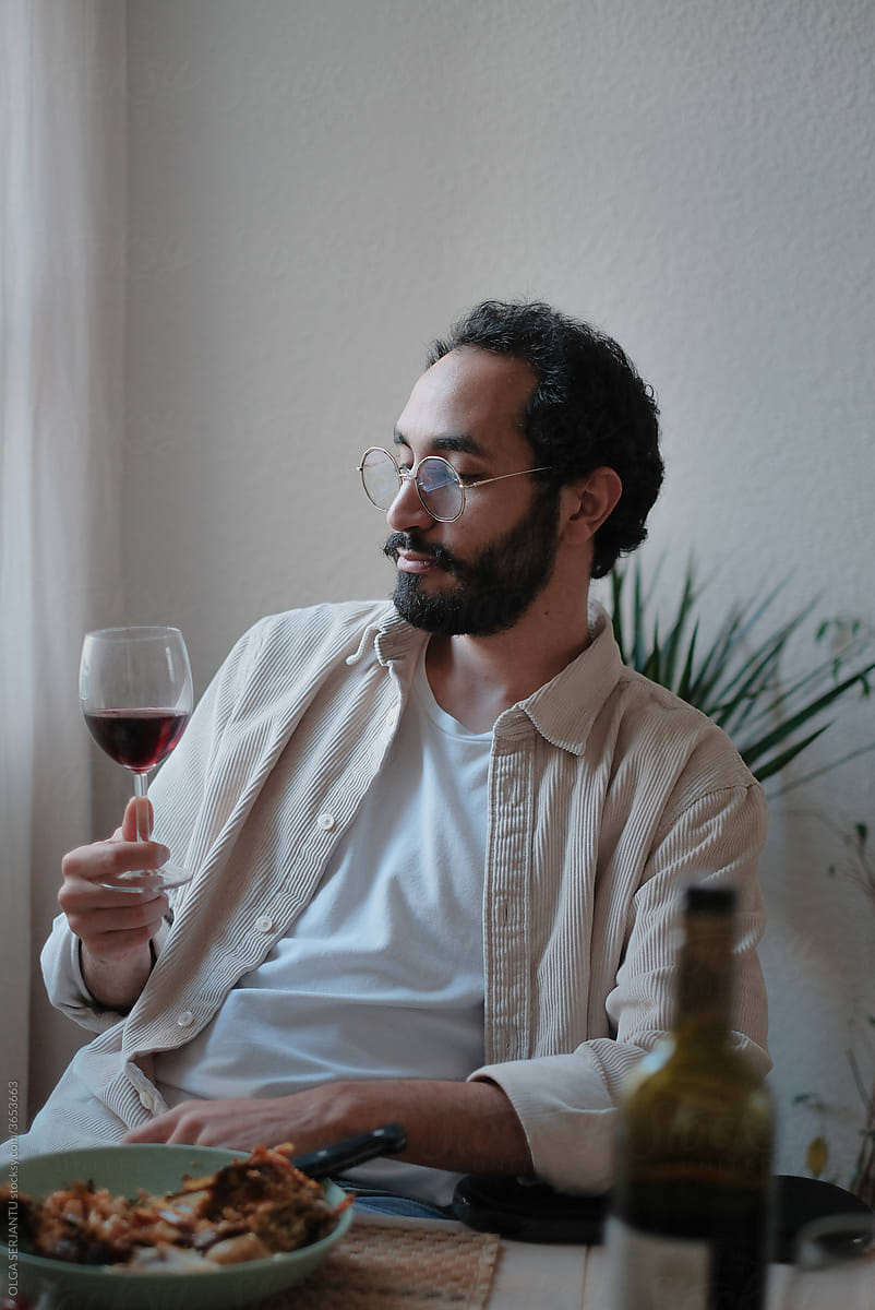 Man drinking a glass of Bordeaux wine