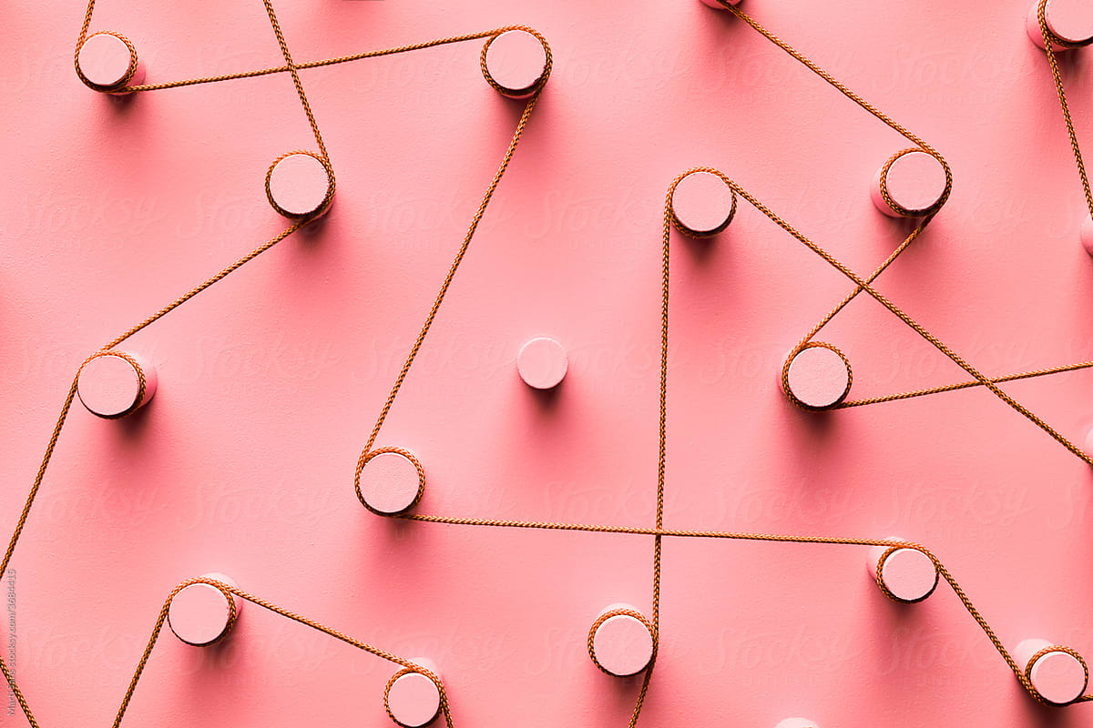Isolated peg in creative network, pink background