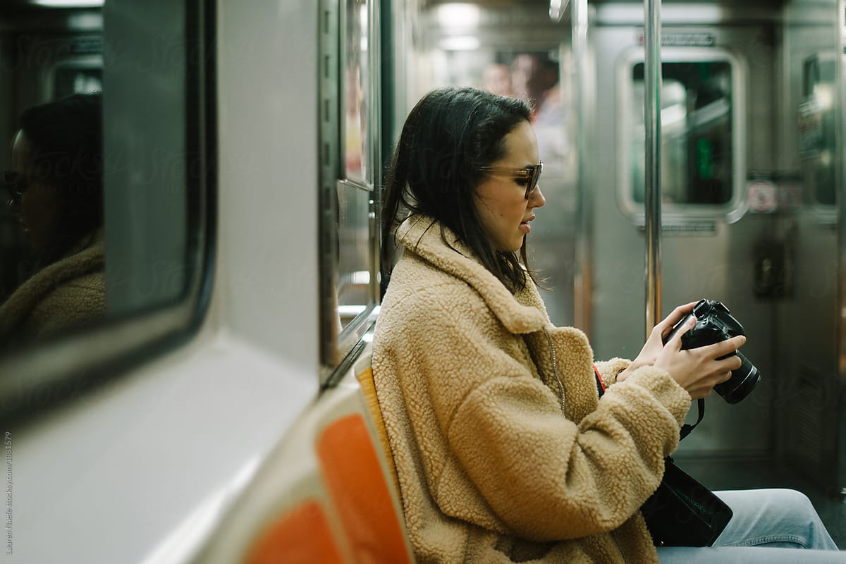 Young Woman Riding The Subway By Stocksy Contributor Lauren Lee