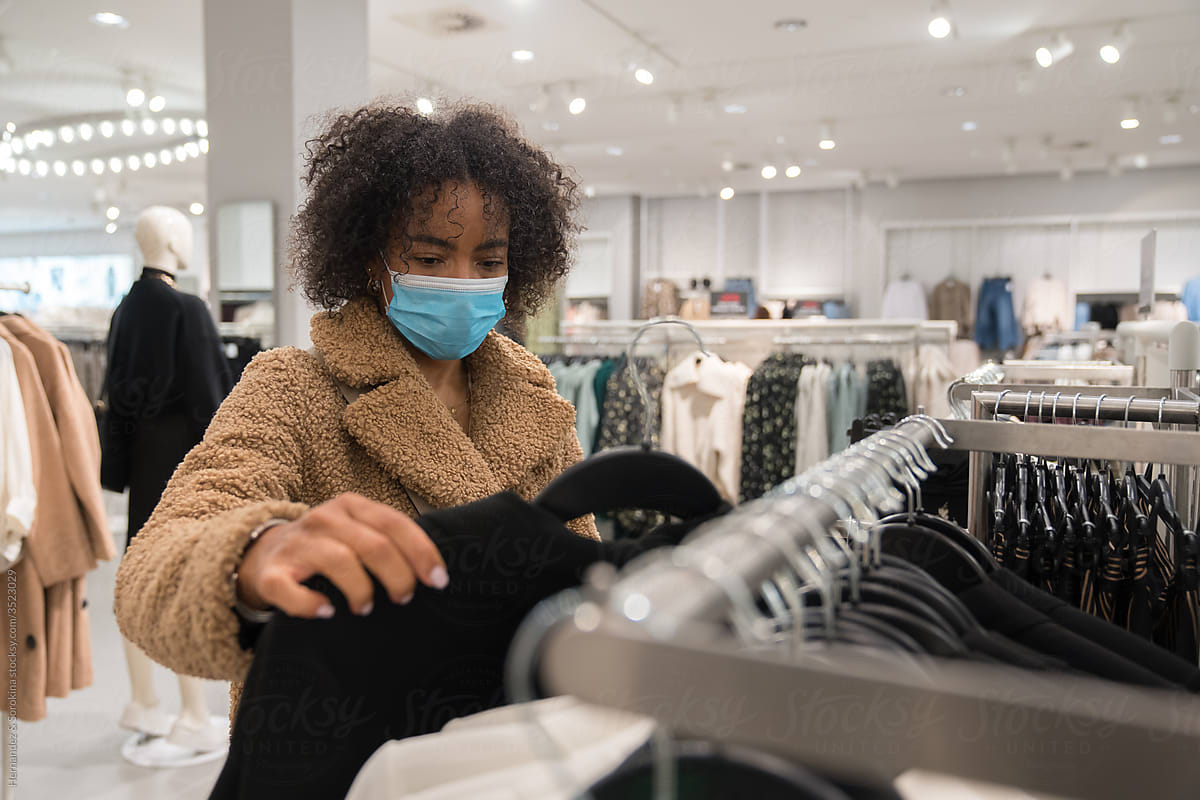 Woman Wearing Mask At Clothes Shop
