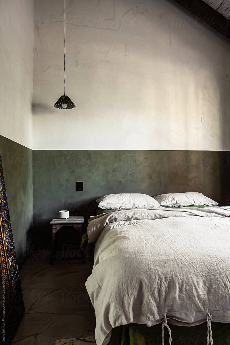 Vintage bedroom with lime wash painted wall