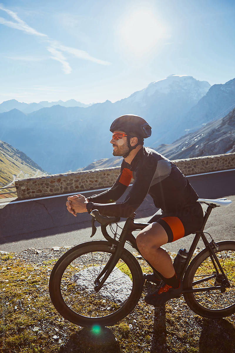 Road Cyclist resting in Alps.