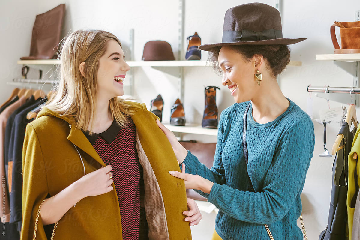 Two Female Friends Shopping Together In The Clothing Store