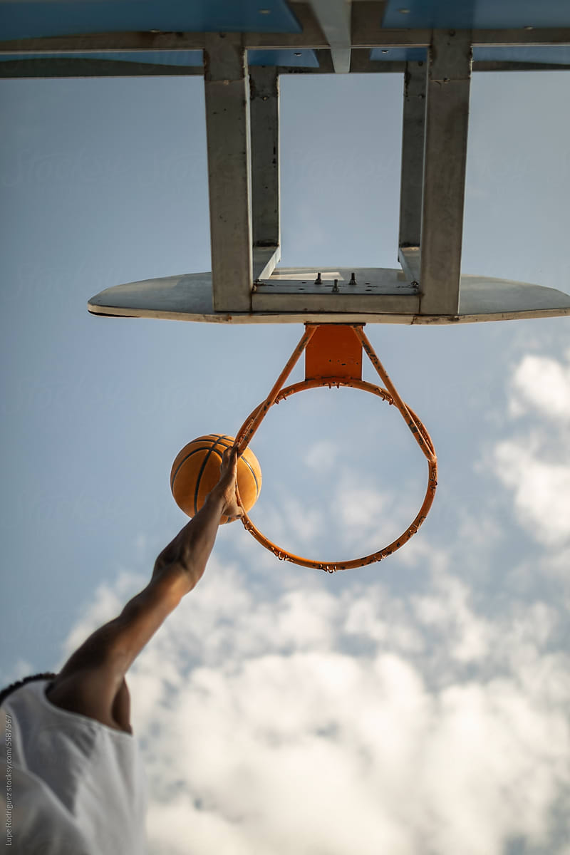 teenage black boy  playing basketball