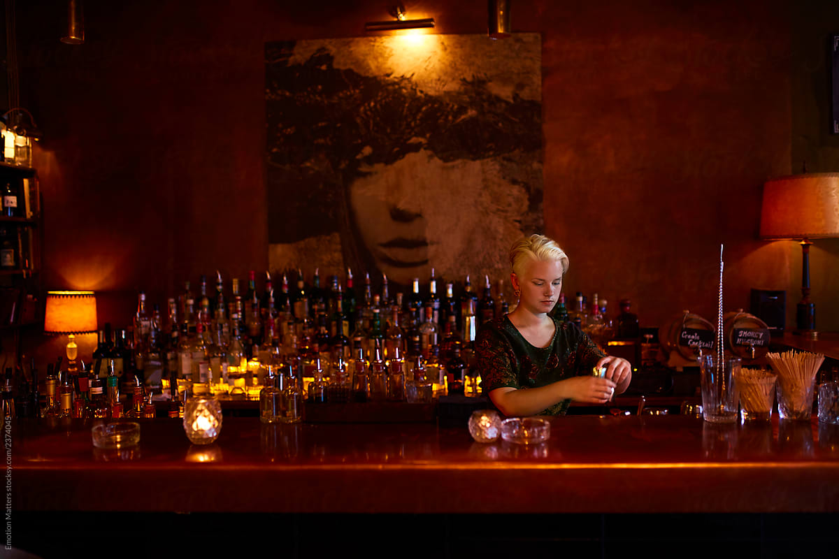 Female bartender prepares the bar.