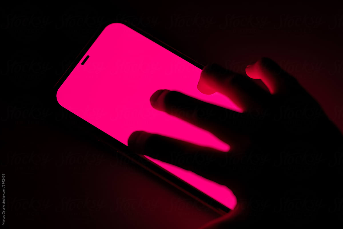 View from above of a hand using smartphone screen