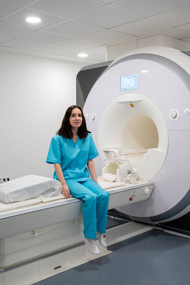 Female sitting on medical MRI scan