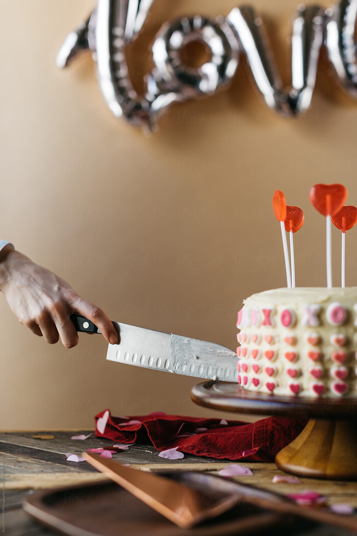Woman Serving Valentine\'s Day Cake at Party
