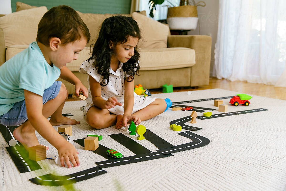 Children playing and learning traffic at home