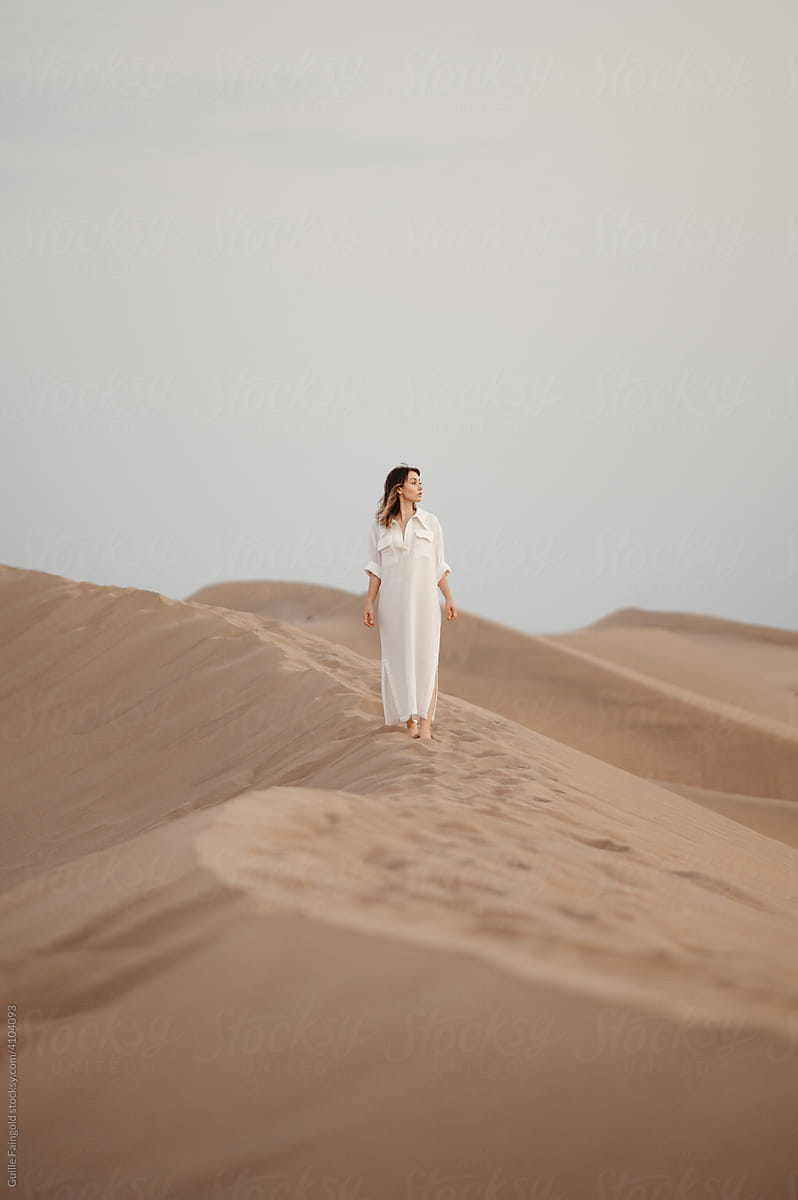 Lonely woman in desert