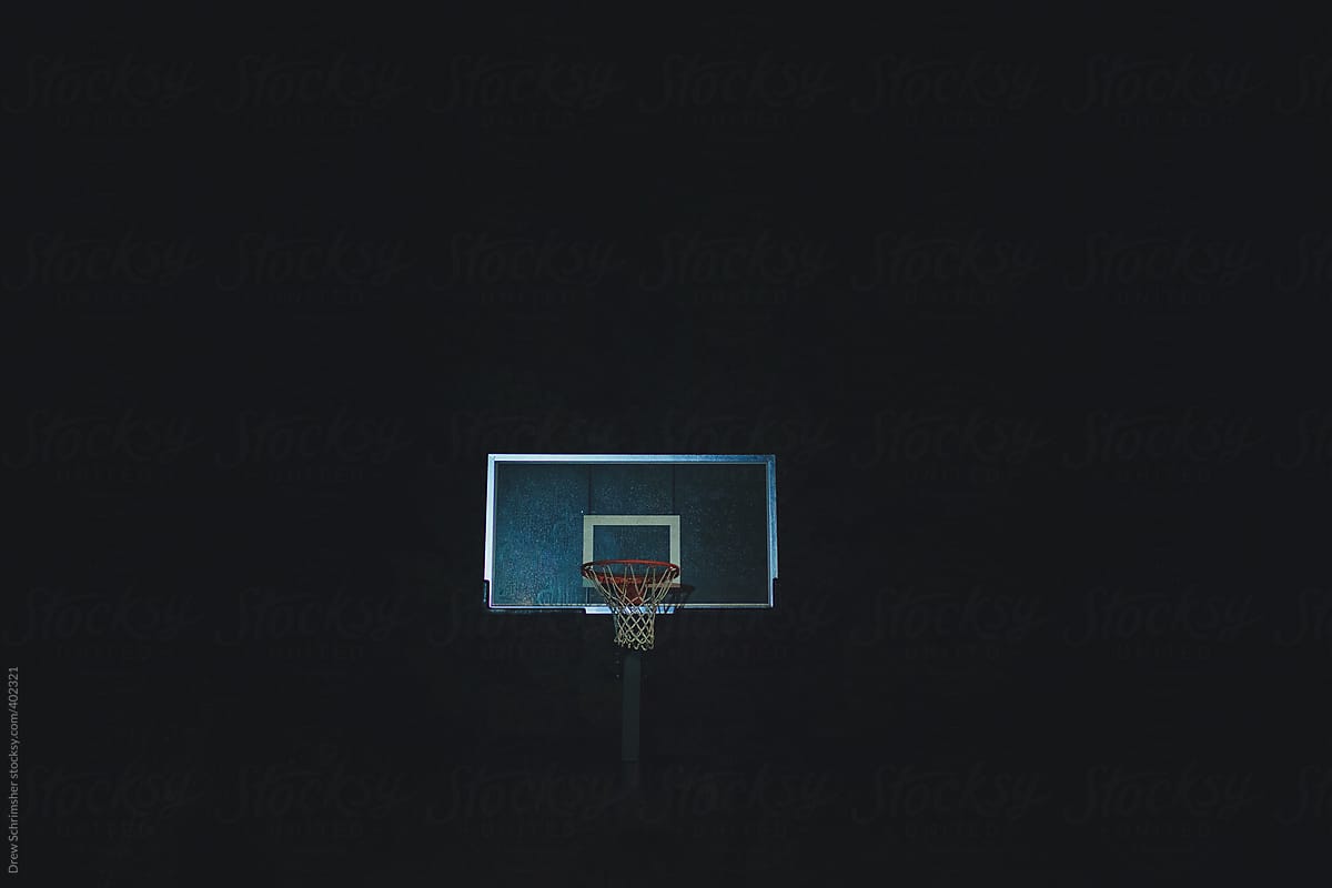 Basketball goal set in the middle of the night