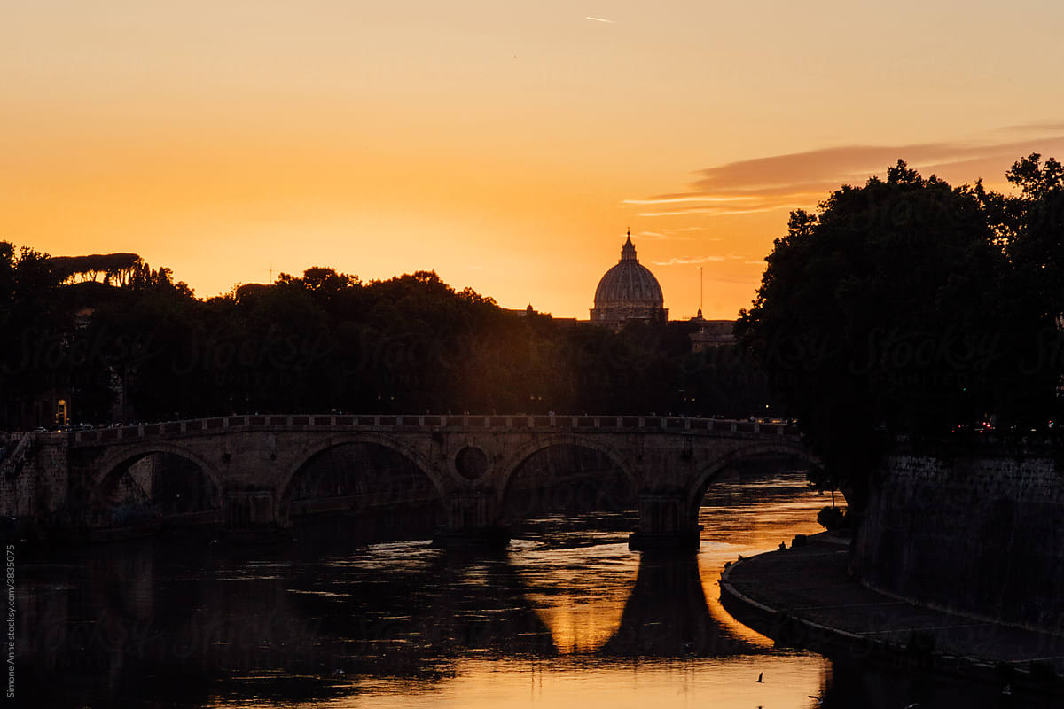 Sunset behind the Tiber river in Rome, Italy