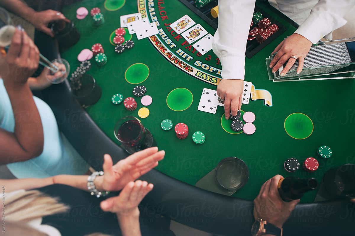 Casino: Dealer Pays Winner At Blackjack Table