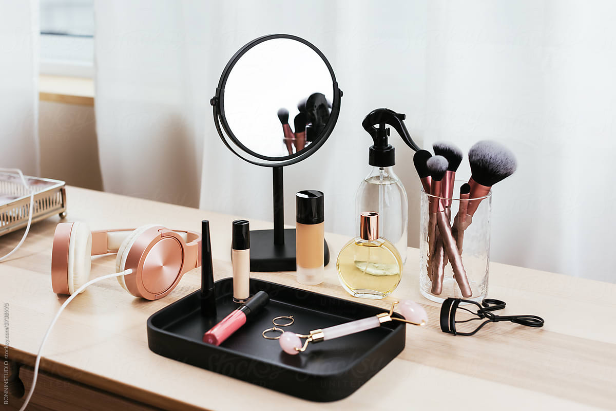 Cosmetic supplies near headphones and mirror