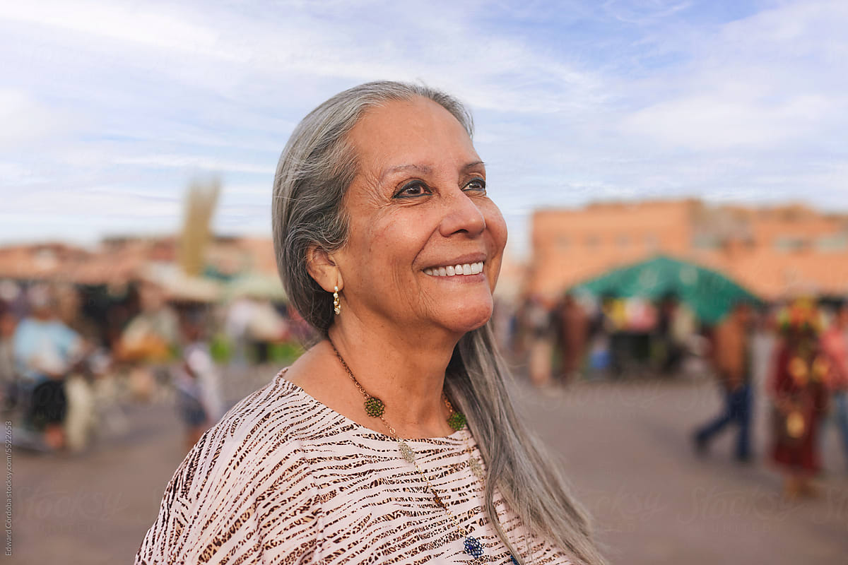 Silky-haired Lady Enjoys Marrakesh: Poses Amidst Vibrant Market