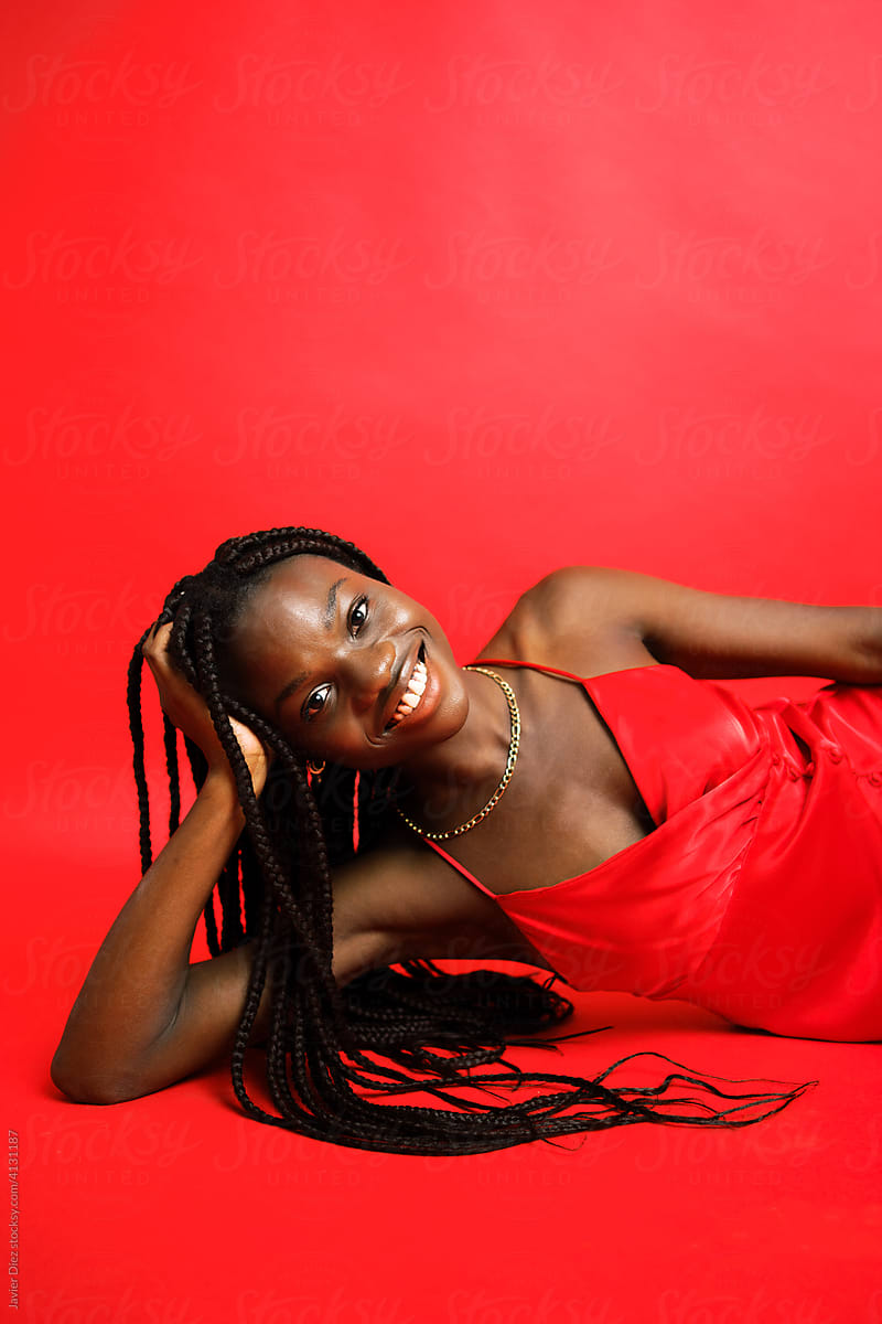 Stylish black woman in red dress