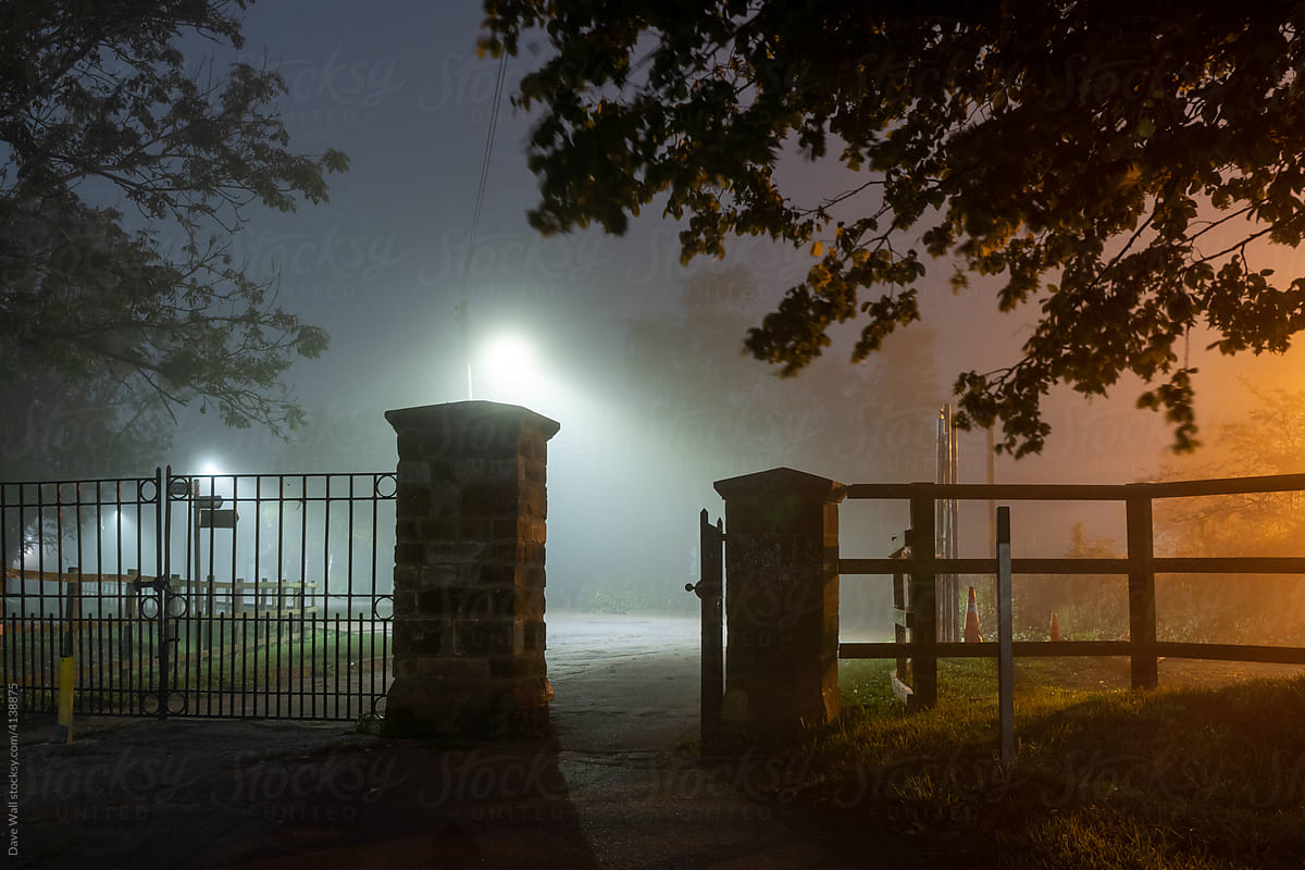 An entrance to a park at night