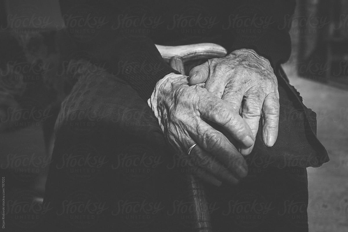 Senior woman old hands with cane