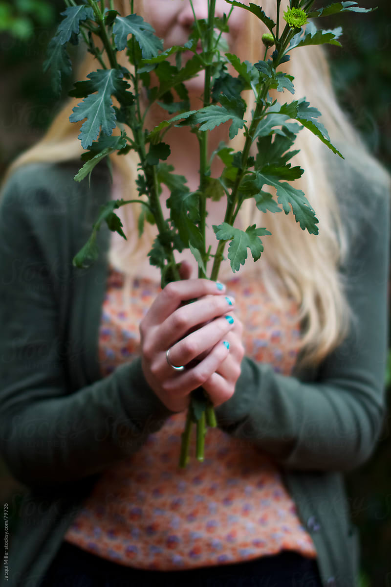 Girl holding flower stems