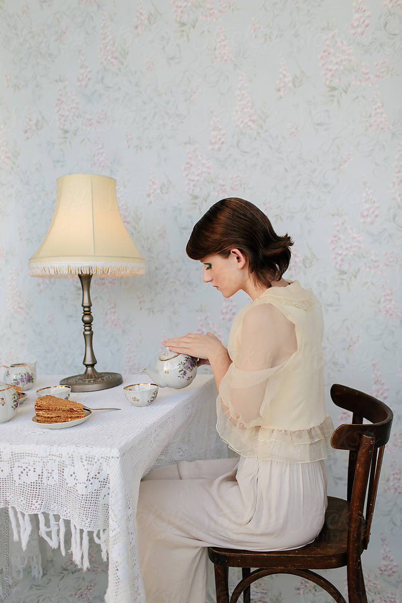 Woman pour tea while have breakfast