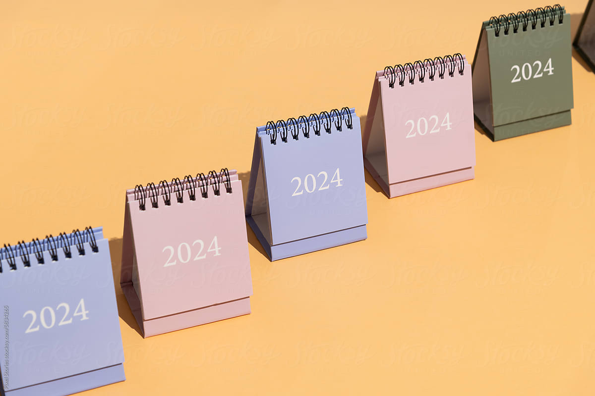 2024 calendars on orange/peach background