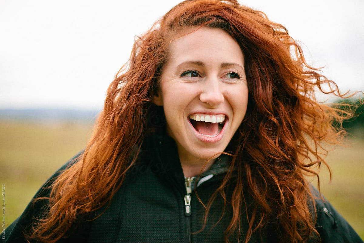Laughing Woman With Red Curly Hair Del Colaborador De Stocksy