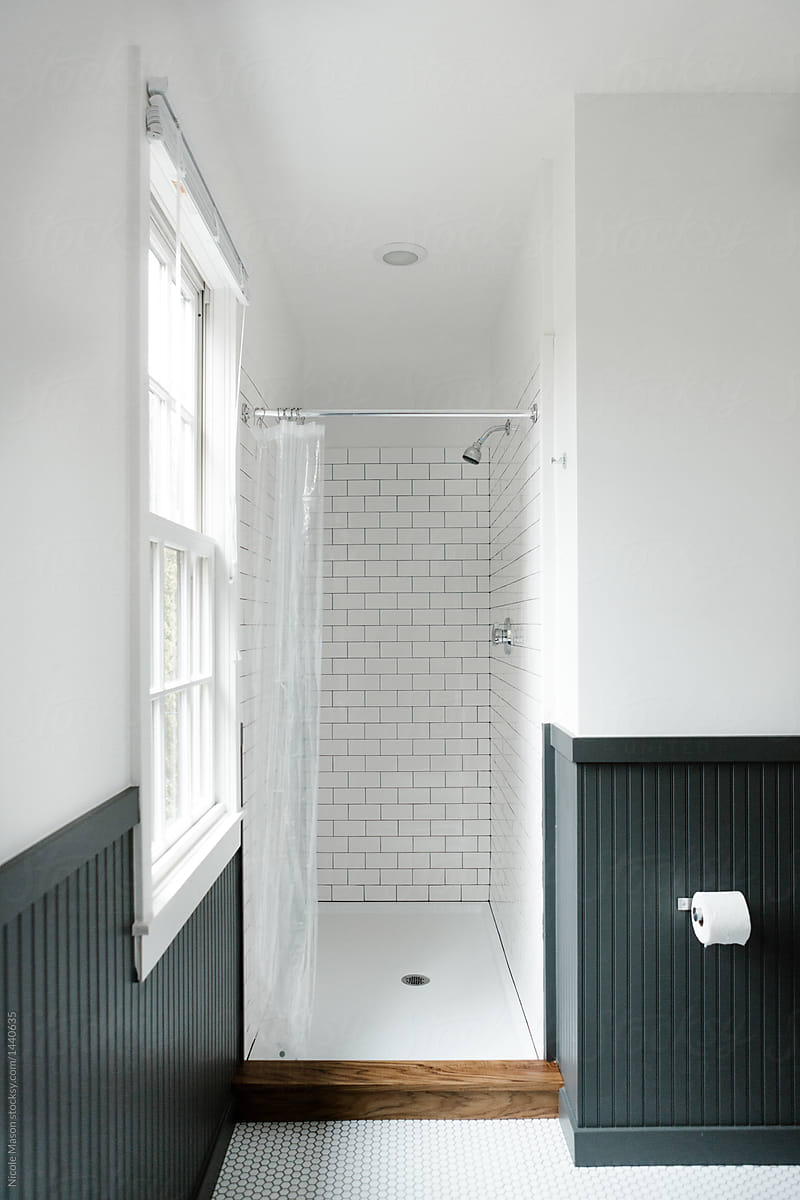 modern bathroom with walls painted half black and half white