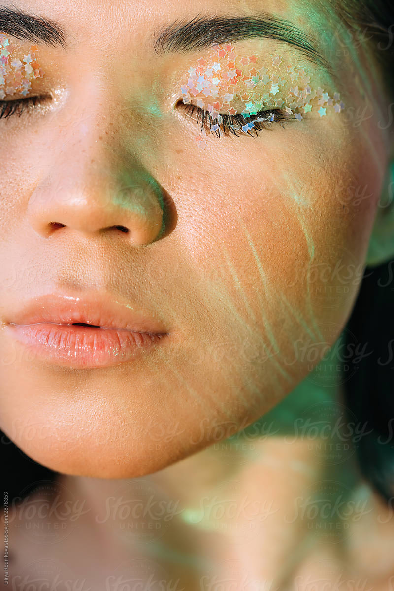 Beauty portrait with flares of light on skin