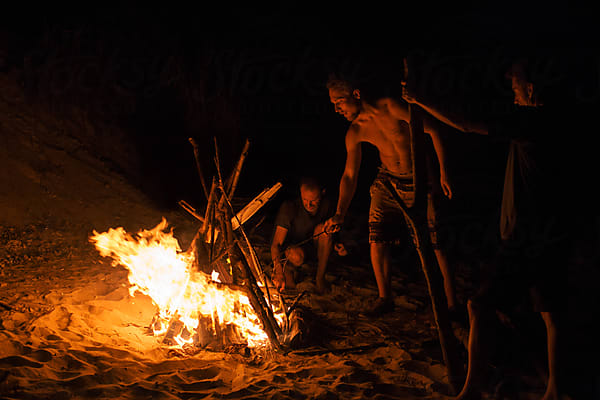 Guys Pulling Rope At The Beach by Stocksy Contributor Mosuno