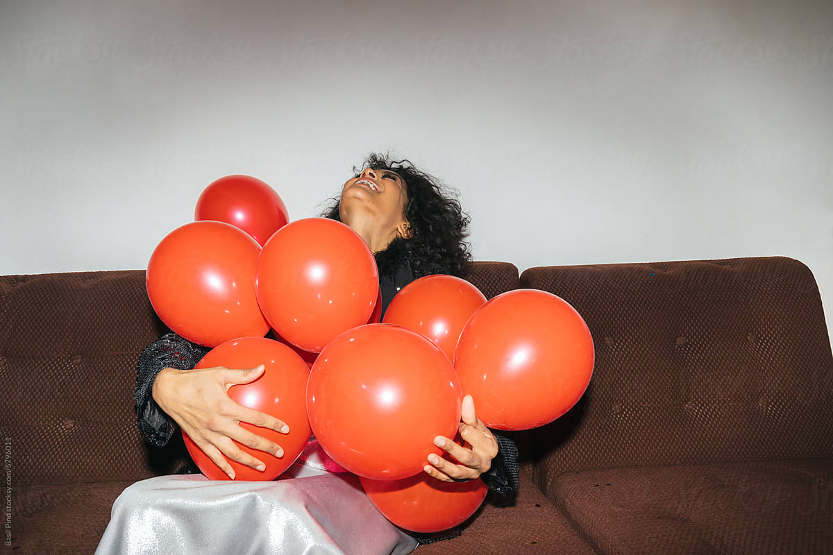 Woman Embracing Red Balloons