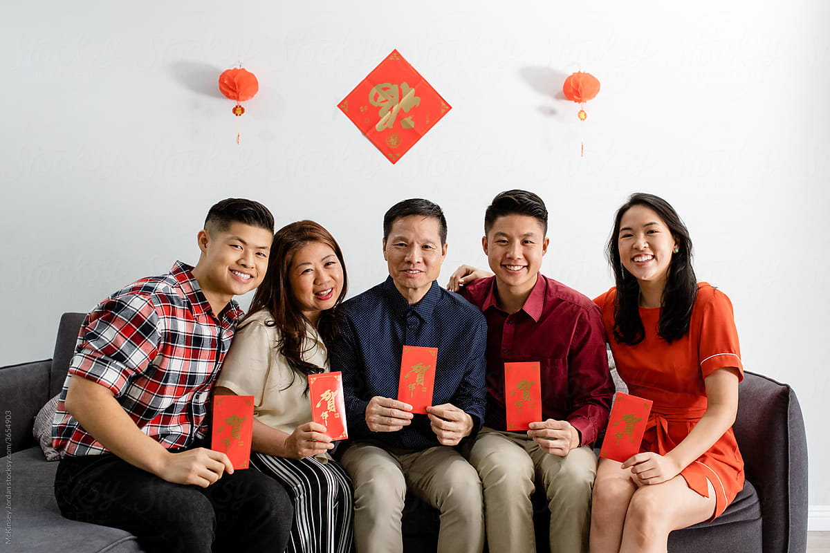 Family Poses With Their Cards