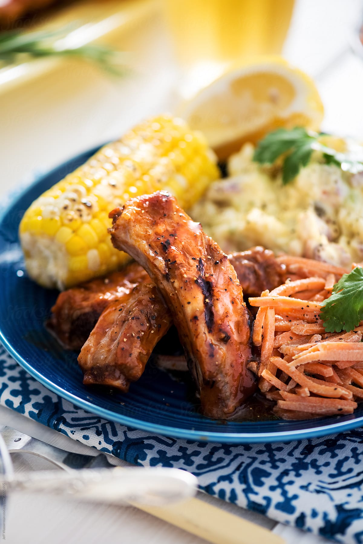 Closeup of Plate of Barbecue Ribs and Corn