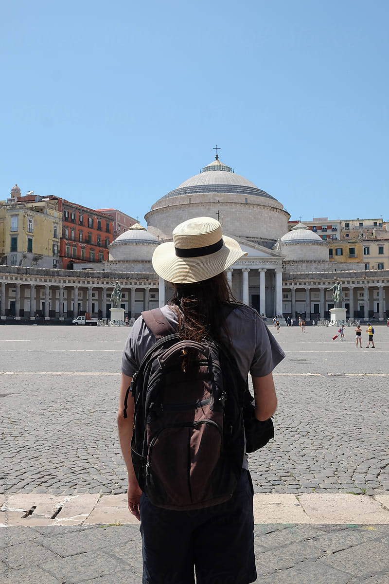 Portrait of an anonymous male tourist with hat from behind in Naples