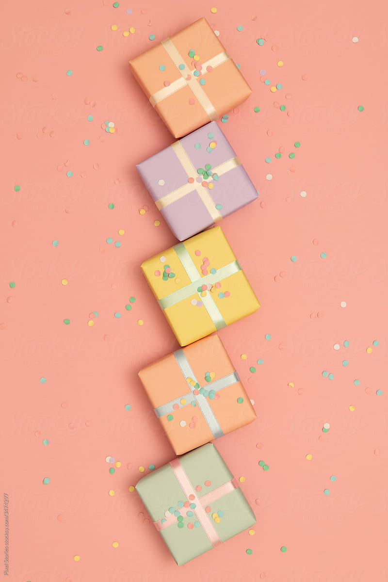 Pastel present/gifts wrapped in pastel ribbons and confetti