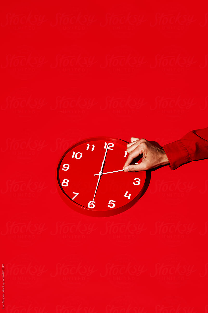 man resetting a red clock