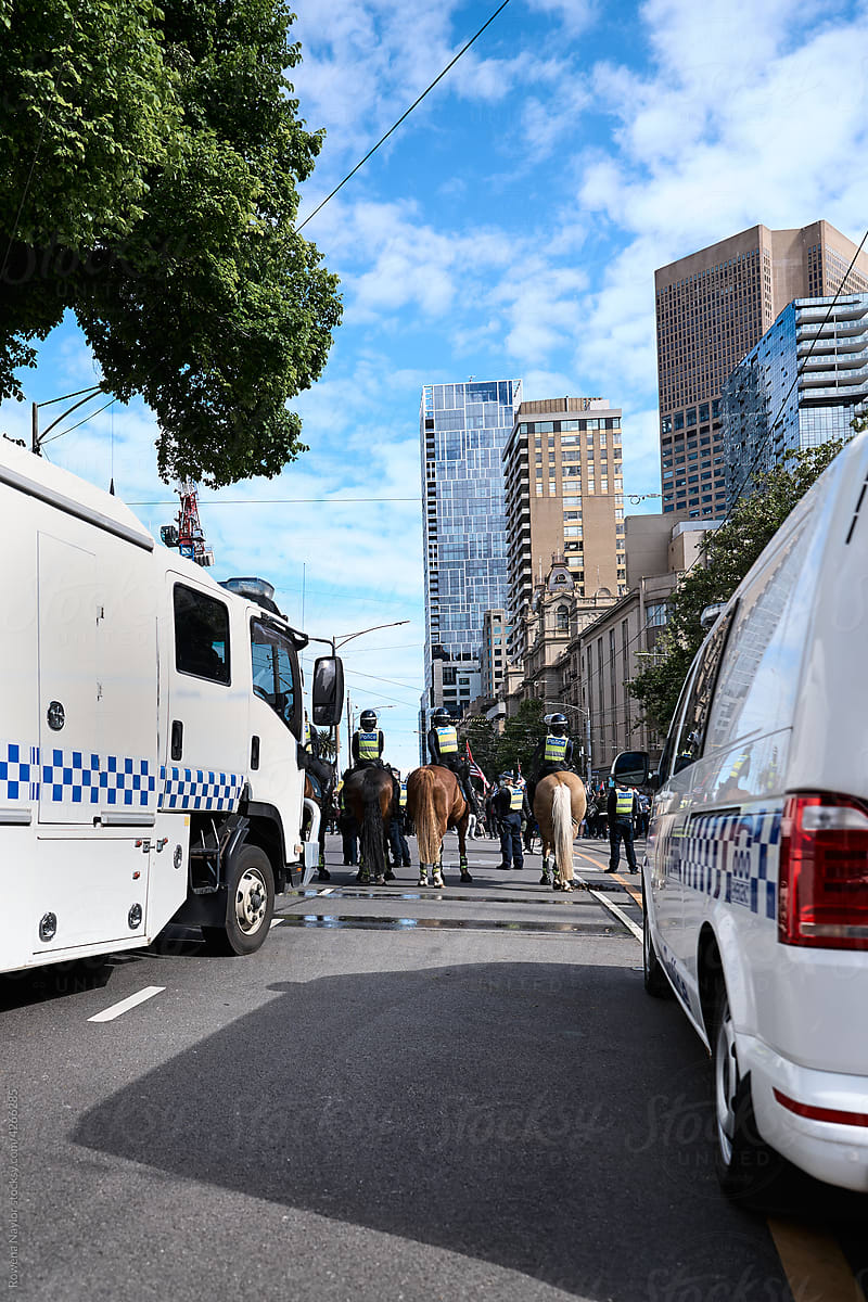 Mounted Police control protesters at Anti-Vaccine march in city