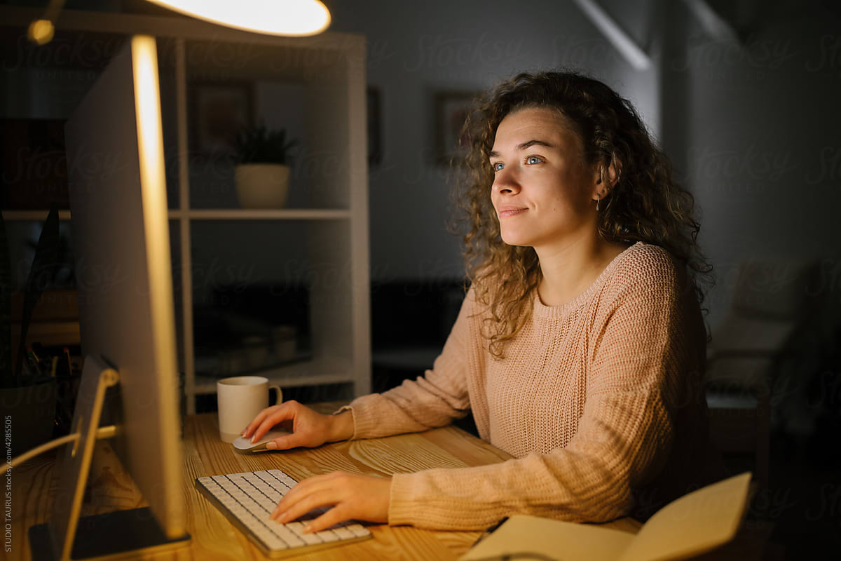 Freelancer woman working from home during night