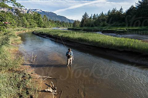 Man Flyfishing On River At Sunset by Stocksy Contributor Jarusha Brown -  Stocksy
