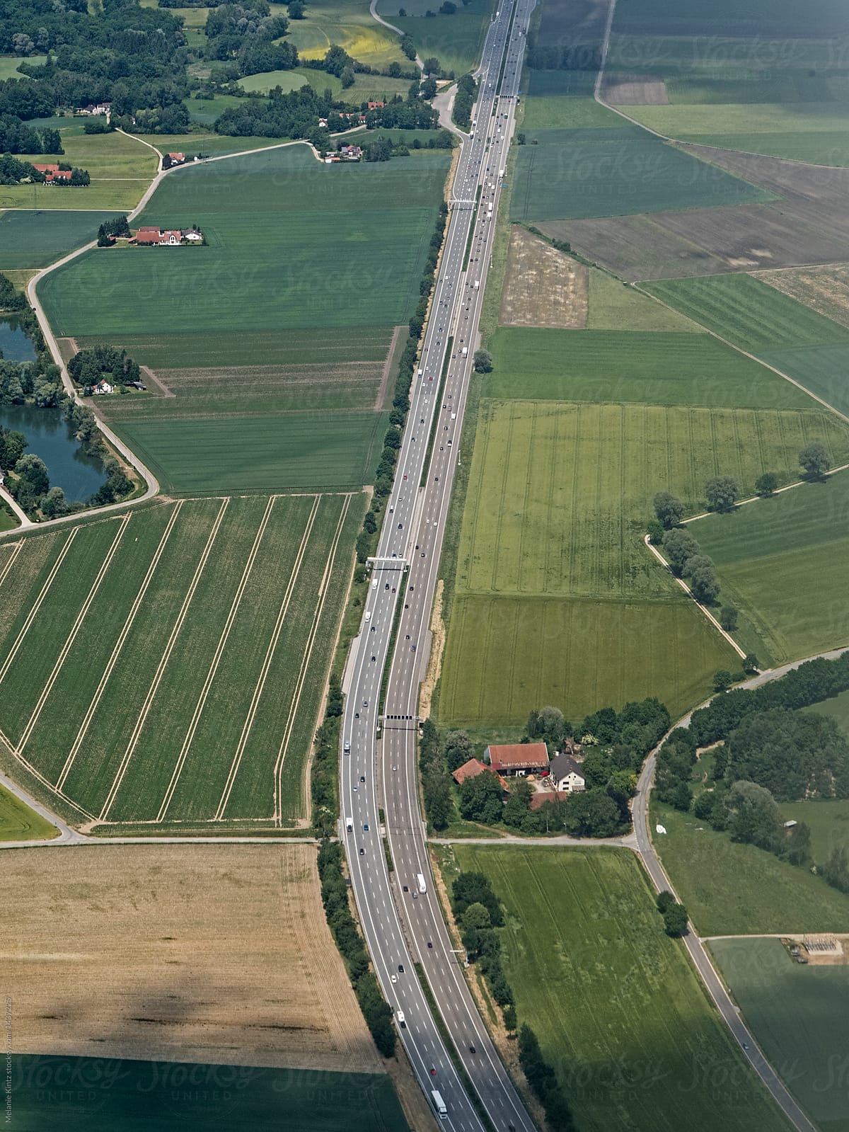 German highway cuts through a rural landscape, airplane shot