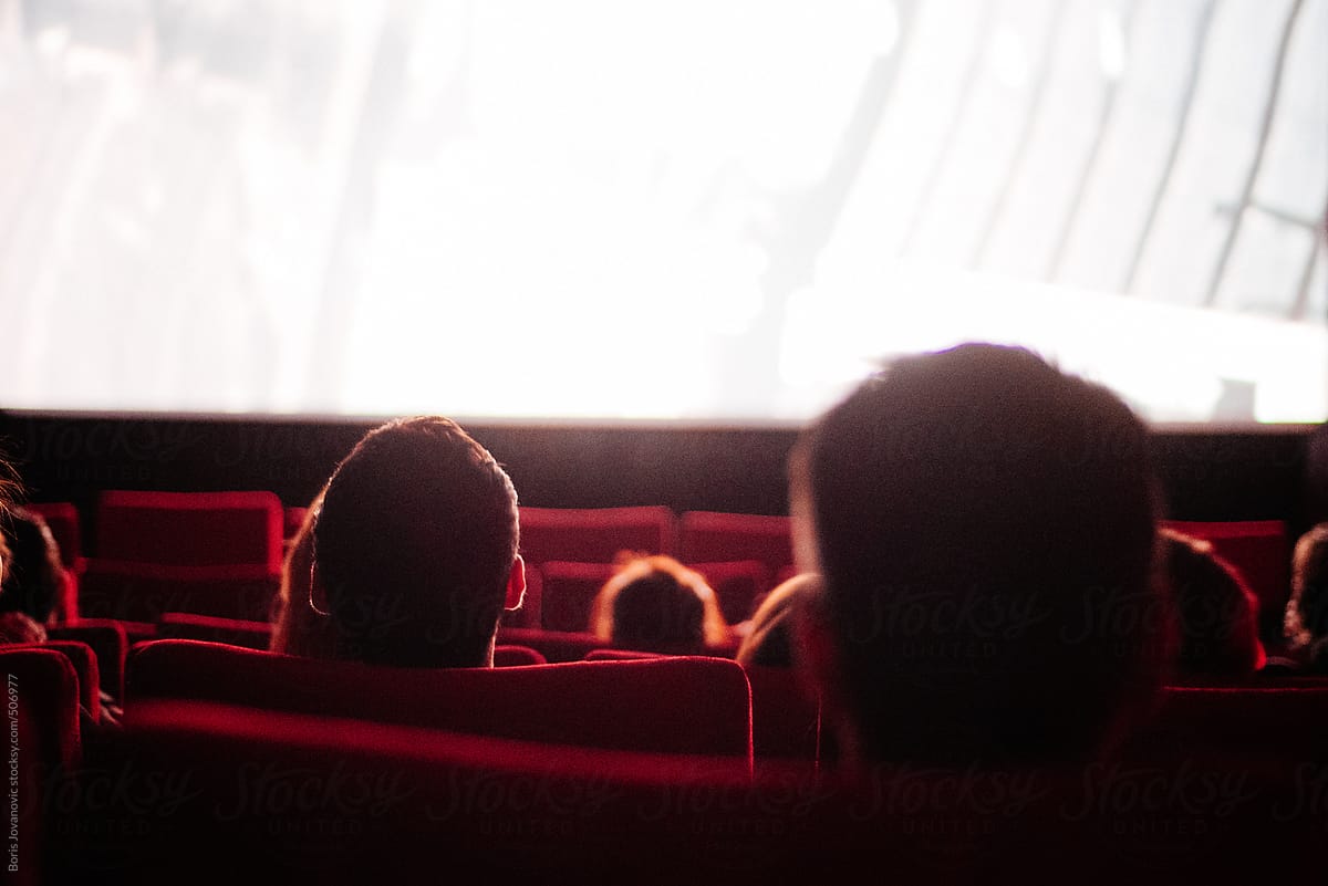 People watching a movie in cinema