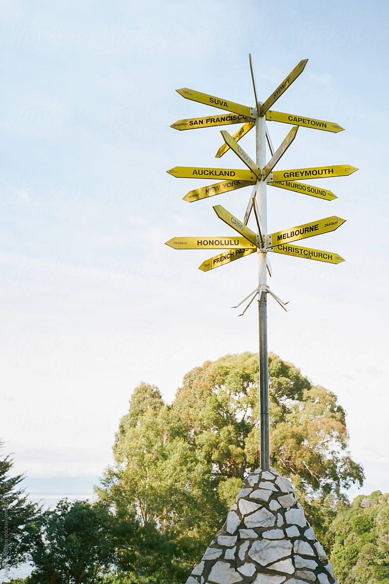 Many signposts at a lookout point in Kaiteriteri New Zealand