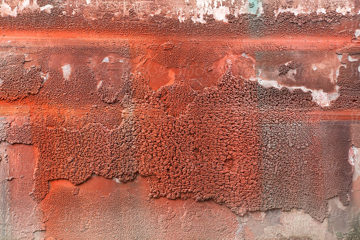 Spray painting with red color on the wall
