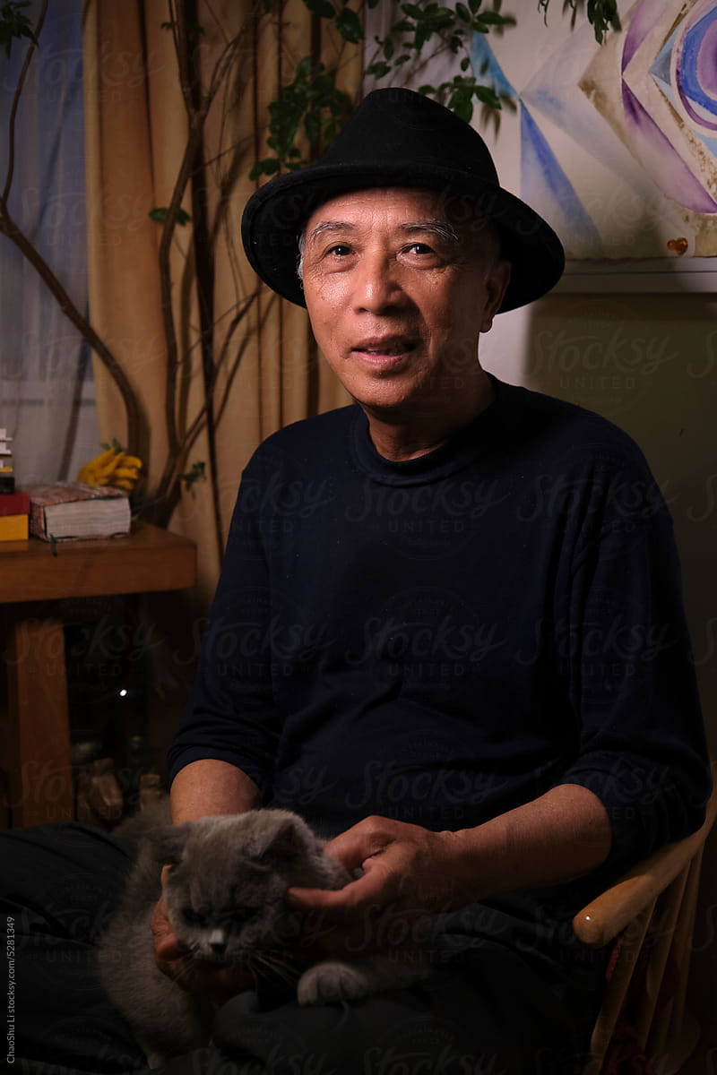 Closeup portrait of handsome and lovely old Asian man