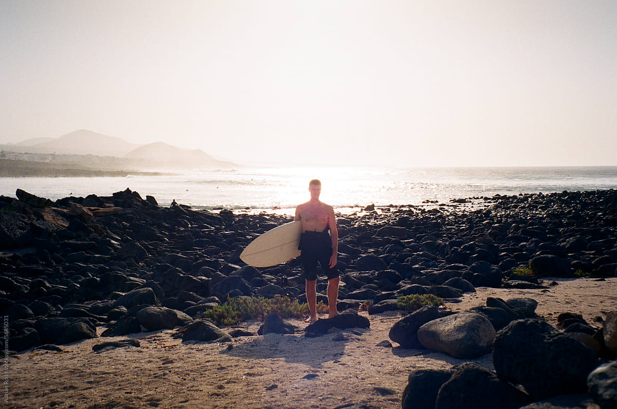 Ride Complete: Surfer Exiting the Waves in Lanzarote