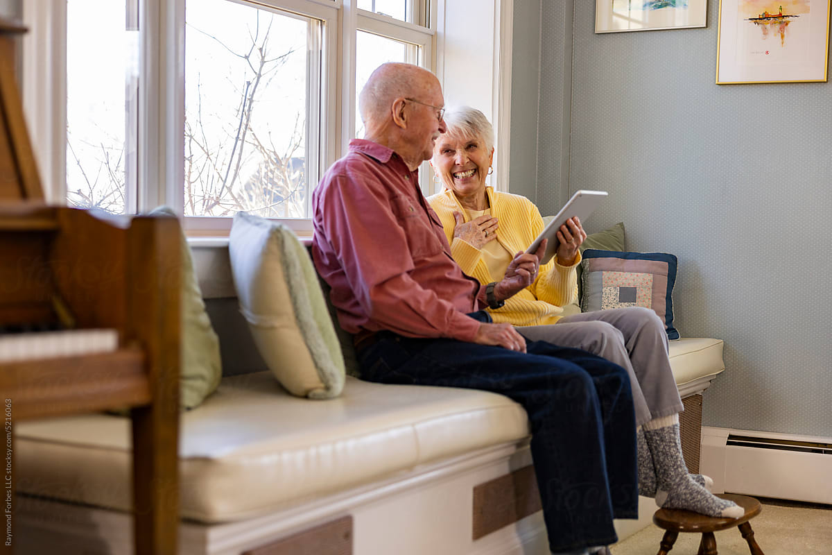 Senior Citizen family couple together with tablet ipad computer