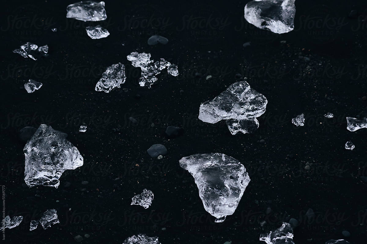 Crystal clear ice floe blocks on Diamond Black Sand Beach in Iceland