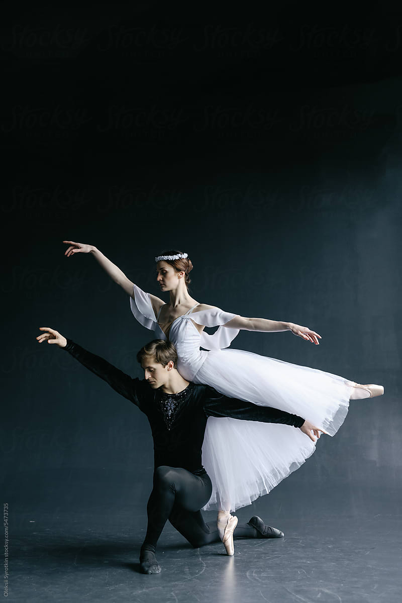 Ballet dancers couple doing hard movements together